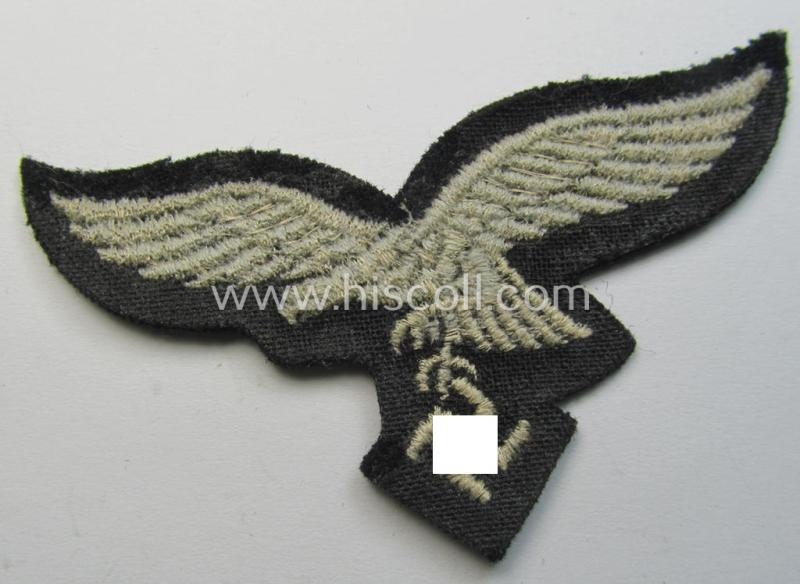 Attractive, WH (Luftwaffe) cap-eagle (being a 'standard-issue'-pattern example that is executed on a black-coloured background and that was as such intended for usage on the black-coloured work- ie. 'HG'-related side-caps ie. 'Schiffchen')