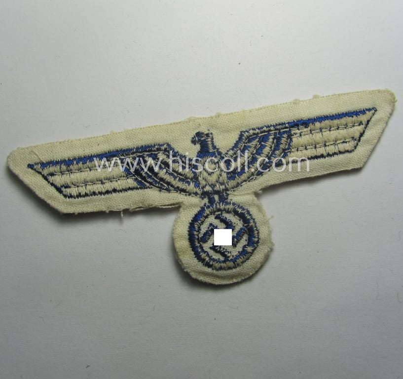 Minimally used- and/or tunic-removed, WH (KM) related breast-eagle (ie. 'Brustadler für Mannschaften u. Uffz. der Kriegsmarine') being a 'standard-issue'-pattern-example as executed in the machine-embroidered-pattern onto a white-coloured background