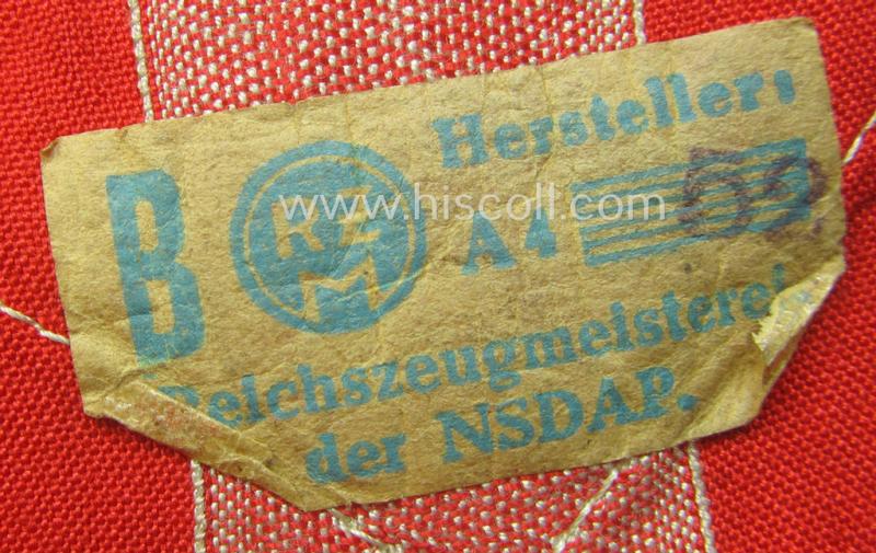 'Standard-issued'-pattern (ie. entirely woven) pattern, bright-red-coloured HJ- (ie. 'Hitlerjugend'-) related armband (ie. 'Armbinde') being a moderately worn- ie. used example that still retains its period 'RzM'-etiket