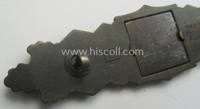 'Nahkampfspange in Bronze' (or: bronze-class close-combat clasp ie. CCC) being a neatly maker-marked- and/or minimally converse-shaped specimen as was produced by the: 'JFS'- (ie. 'Joseph Feix u. Söhne'-) company