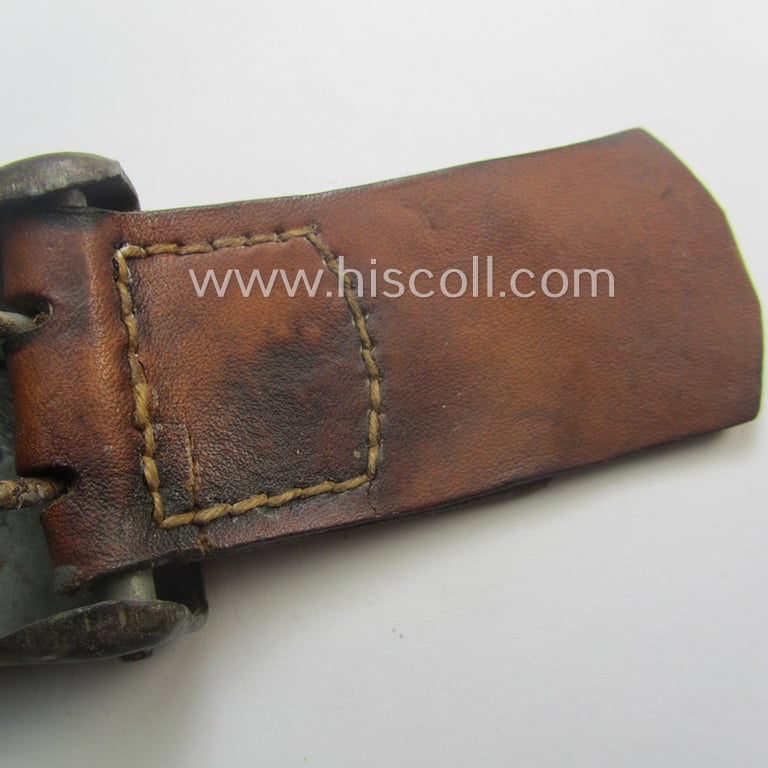 RLB (ie. 'Reichsluftschutz-Bund'), steel-based EM- (ie. NCO-) type belt-buckle (of the third- and final pattern) being a non-maker-marked example that comes mounted onto its maker-marked and/or: '1942'-dated tab