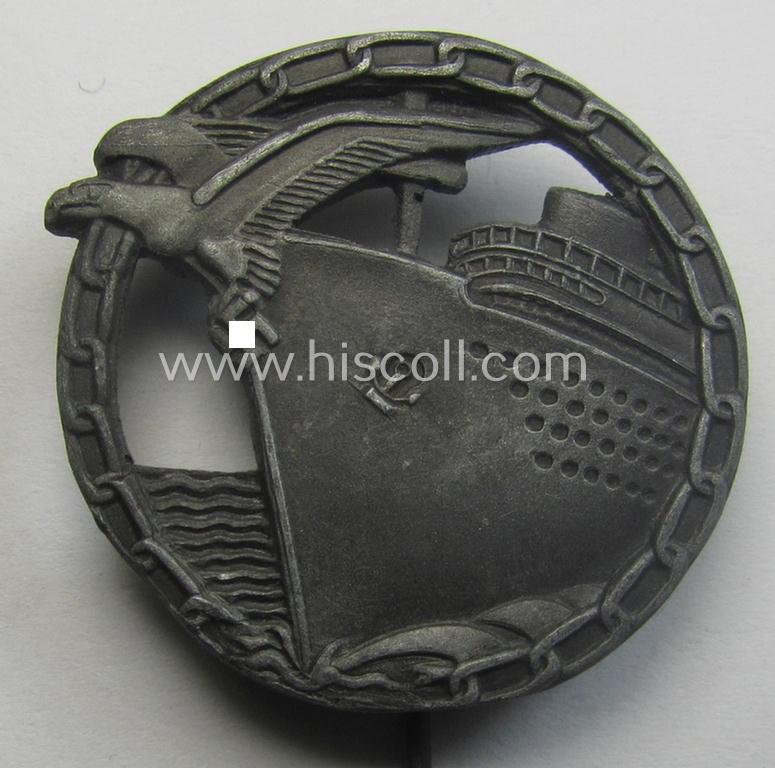 Smaller-sized example (ie. 'Halbminiatur') of a WH (KM) 'Blockadebrecher-Kriegsabzeichen' (or: blocade-runner war-badge) being a detailed, non-maker-marked example as executed in zinc-based metal (ie. 'Feinzink')