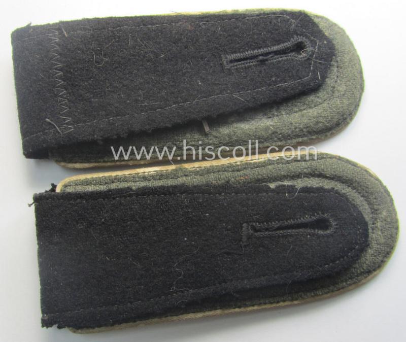 Superb pair of Waffen-SS NCO-type, 'cyphered' shoulderstraps as piped in the white-coloured branchcolour as was intended for usage by an: 'SS-Oberscharführer' who served within the: SS-Rgt. 'Deutschland' (2. SS-Pz-Div. "Das Reich")