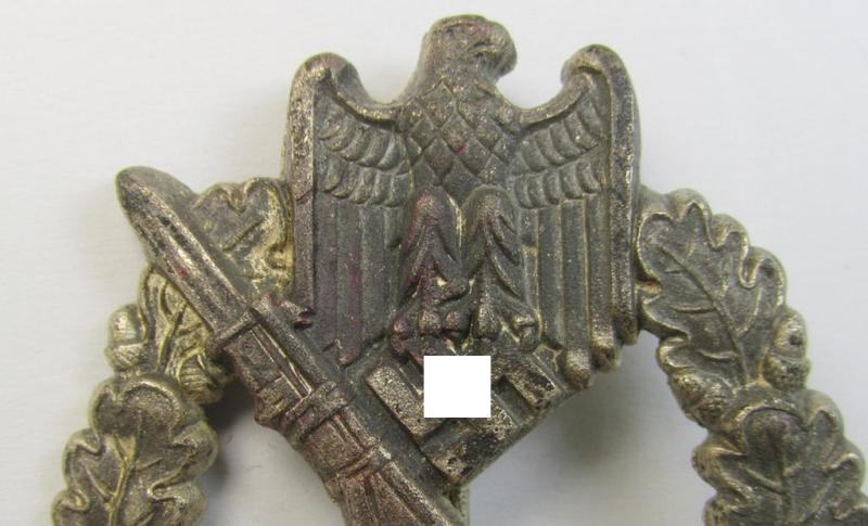 Attractive, 'hollow-back'-pattern 'Infanterie Sturmabzeichen in Silber' (or: silver infantry-assault badge ie. IAB) being a non-maker-marked example as executed in zinc-based metal (ie. 'Feinzink') as was produced by the: 'Wilh. Deumer'-compa...