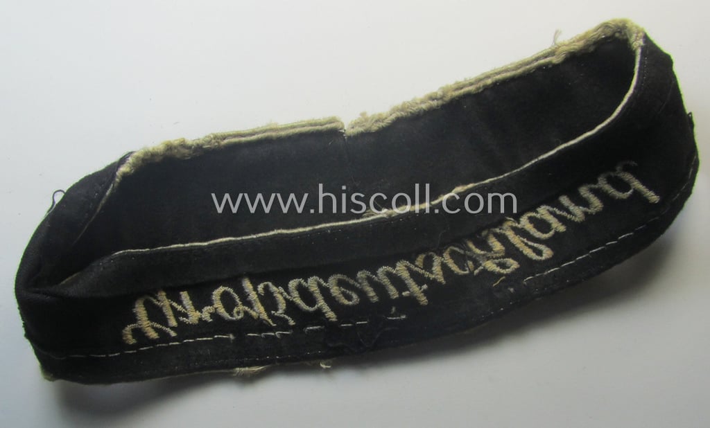 Truly used- and/or worn example of a WH (Heeres) cuff-title ie. armband (ie. 'Ärmelstreifen') entitled: 'Grossdeutschland' (being a neatly machine-embroidered example of the third pattern that was specifically intended for EM- ie. NCO-usage)