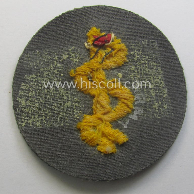 WH (Heeres) hand-embroidered, trade- ie. special-career arm-patch as was intended for a: 'Sanitäter' (or: medical orderly) being a maker-marked example as executed on darker-green-coloured wool
