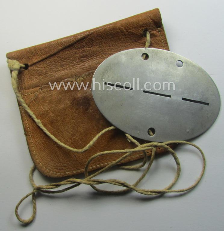 Aluminium-based, WH (Heeres-) transport (ie. 'Nachshub'-) related ID-disc, bearing the clearly stamped unit-designation: '4./Kf.Ers.Abt. 6' and that comes stored in its period- (and personalised!) pouch as issued and/or worn