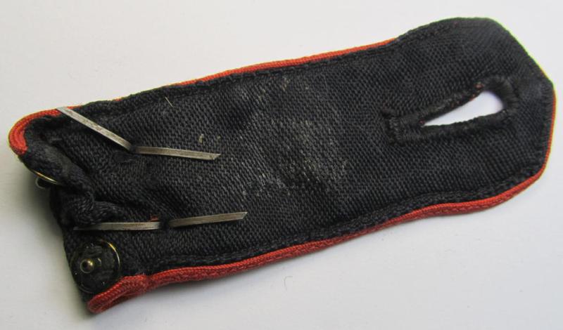 Moderately worn - albeit regrettably single! - bright-red-piped so-called: 'Allgemeine-HJ'-shoulderstrap as intended for an: 'HJ-Scharführer' who served within the 'Bann 241' (241 = 'Bann Oberbergisch' situated in the 'Gebiet West-Mittelrhei...