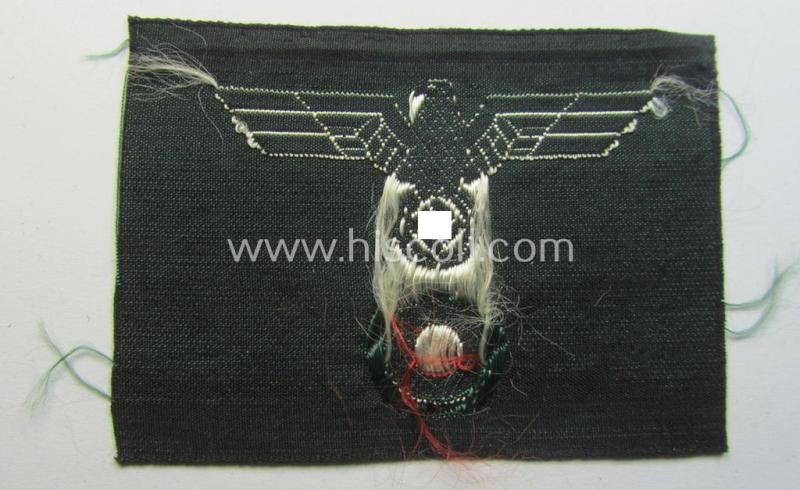 WH (Heeres) so-called: 'M43-pattern') cap-eagle/cocarde (ie. cap-trapezoid) being a Belgian-produced 'variant' as was specifically produced for usage on the so-called: 'M-43'-model field-caps (ie. 'Einheitsfeldmützen')