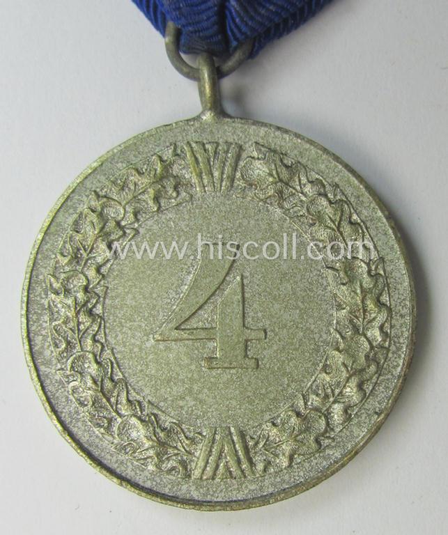 WH (Luftwaffe) bright silver-toned 'WH-DA der 4. Klasse für 4 Jahre Dienstzeit' that comes mounted onto its accompanying ribbon (ie. 'Bandabschnitt') having a silver-toned eagle-device attached