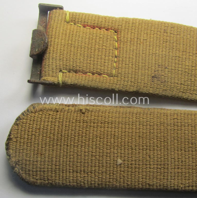 WH (Heeres ie. LW etc.) 'tropical-issued'- and entirely 'web-based' belt (ie. 'Koppelriemen') being a maker- (ie. 'Kurt Seidel - Berlin W 36 - 1943'-) marked and/or 95 cms.-sized example