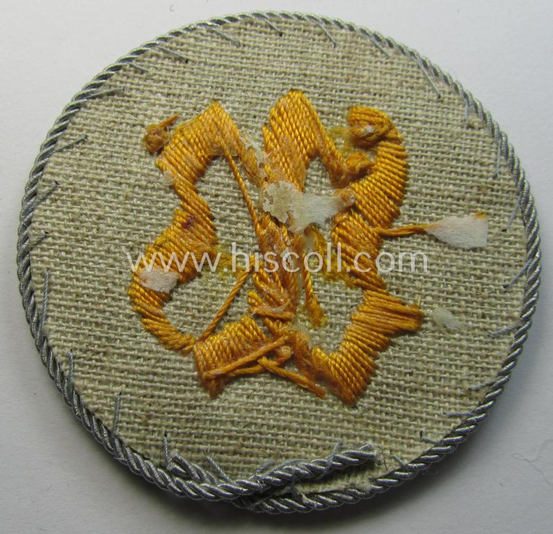 WH (Heeres) hand-embroidered trade- and/or special-career arm-insignia: 'geprüfter Wallmeister' (having a silver 'Kordel' attached)