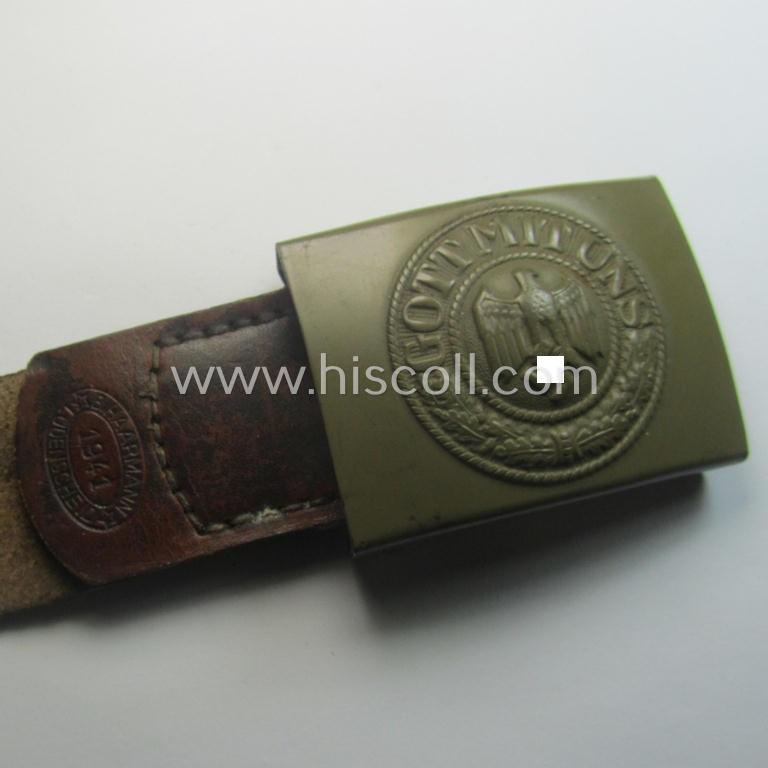 'Virtually mint', 'standard-issue'-pattern, WH (Heeres) field-grey-toned- and/or steel-based belt-buckle being a non-maker-marked example that comes mounted onto its 'B. Haarmann'-marked and/or '1941'-dated tab