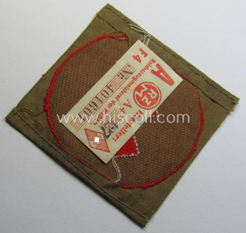 Attractive, DJ (ie. 'Deutsches Jungvolk') arm-badge as was intended for usage by a member who served within the: 'Oberbann 1' (being a 'virtually mint- ie. unissued' example that still shows its 'RzM'-etiket)