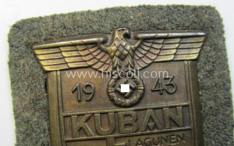 Very attractive - and actually scarcely encountered! - WH (Heeres ie. Waffen-SS) 'Kuban'-campaign-shield that comes mounted onto its original field-grey-coloured- and/or woolen-based 'backing'