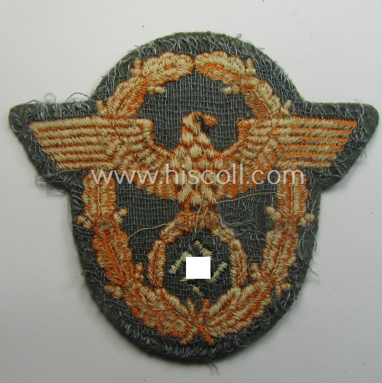 Field-police- (ie. WH-Heeres) related-) arm-eagle (ie. 'Ärmeladler') as was intended for usage by the staff of the notorious 'Feldgendarmerie-Trpn.'