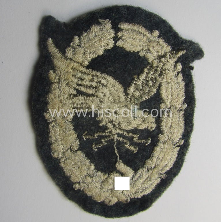 Truly used, WH (Luftwaffe): 'Fliegerschützen-Abz. mit Blitzbündel in Stoff' (or: cloth air-gunners-badge with lightning-bolts) being a nicely executed and typical machine-embroidered specimen
