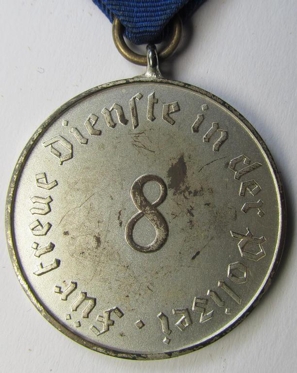 Attractive, bright-silver-toned, so-called: 'Polizei-Dienstauszeichnung 3. Stufe' (or: police loyal-service medal third-class) that comes mounted onto its period ribbon (ie. 'Bandabschnitt')