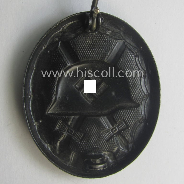 Hardly used- nor worn (ie. 'virtually mint- ie. unissued'!) example of a black-class wound-badge (or: 'Verwundeten-Abzeichen in Schwarz') being a typical magnetic and/or non-maker-marked example