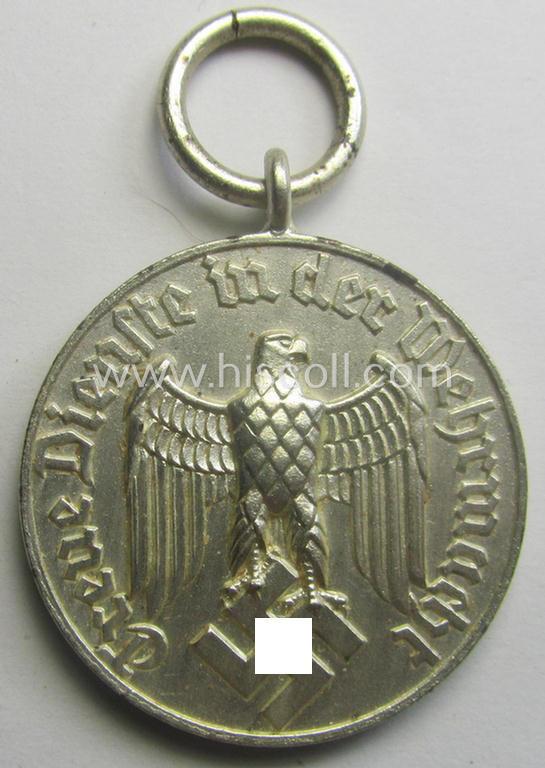 Superb - and usually seen! - WH (Luftwaffe) bright-silver-toned, 'WH-DA der 4. Klasse für 4 Jahre Dienstzeit' that comes with its accompanying ribbon (ie. 'Bandabschnitt') and eagle-device as stored in its period 'Cellophan'-based pouch