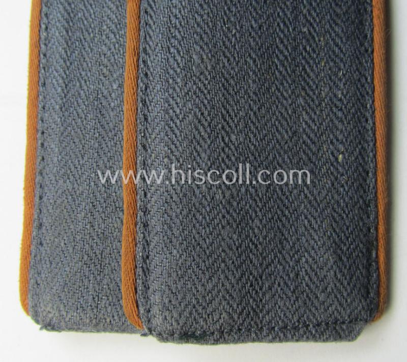 Pair of WH (Luftwaffe) EM-type shoulderstraps as was executed in typical 'HBT'-type cloth and piped in the copper-brown-coloured branchcolour for usage by a: 'Soldat der Nachrichten-Truppen'