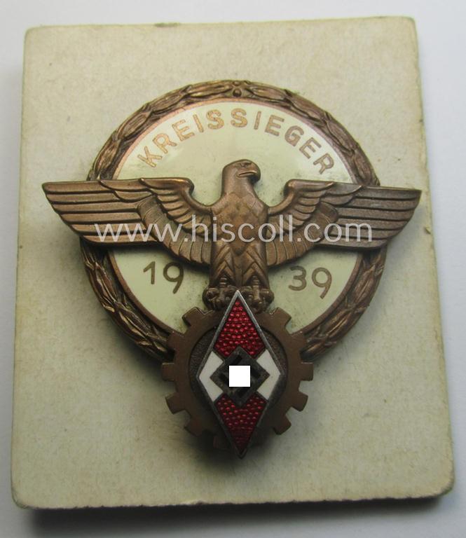 'HJ'- ('Hitlerjugend') ie. 'BDM'-related: 'Reichsberufswettkampf-Siegerabzeichen' (of the 2nd model) entitled: 'Kreissieger 1939' and being a maker- (ie.: 'Ferd. Wagner'-) marked example that comes with its period 'etui-inlay'