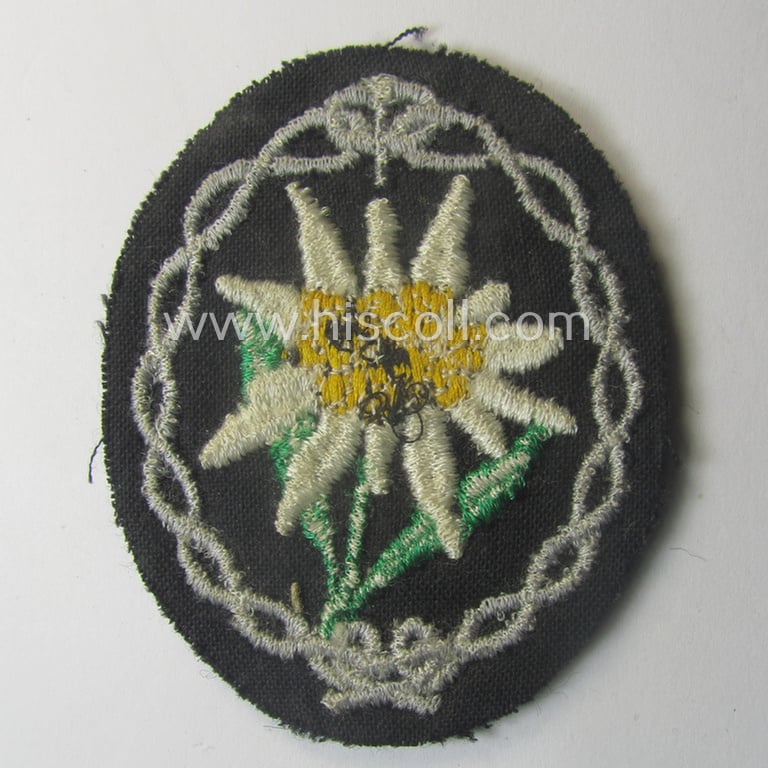 WH (Heeres) EM- (ie. NCO-) type: 'Edelweiss'-armpatch (being a machine-embroidered specimen)