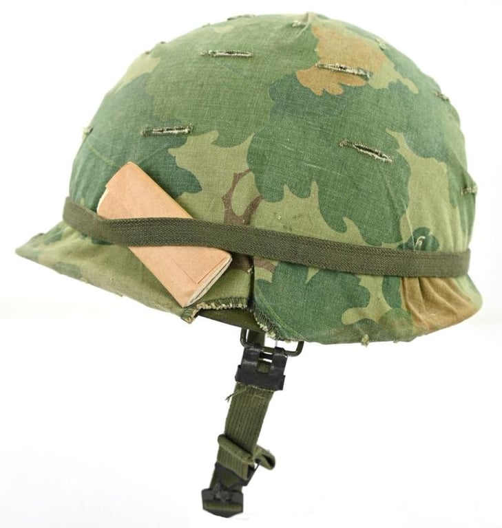 US Vietnam War Infantry helmet with camouflage cover and attached content