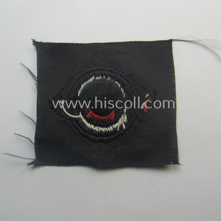 Mid-war-period, WH (Heeres) 'Panzer' cap-eagle & cocarde-set (ie. 'Schiffchenmützen-Adler u. Kokarde-Satz für Mannschaften u. Uffz.') being a 'virtually mint' set as executed in bluish-grey-coloured linnen onto a black-coloured background