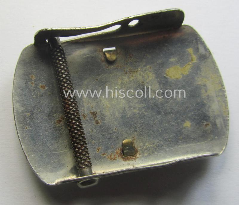 Bright-silver-toned (ie. chromed metal-based) patriotic belt-buckle (ie. N.S.D.A.P.-supportive-piece) that shows a bronze-toned swastika surrounded by a pronounced rim