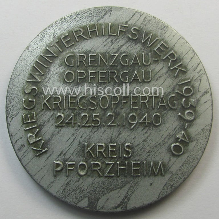 Silver-toned- (ie. 'zinc'-based), WHW-commemorative-plaque entitled: 'Grossdeutschland kämpft für den Frieden gegen den Schandvertrag von Versailles - 1939' (ie. 'WHW Kriegsopfertag - 24.-25.2.1940 - Kreis Pforzheim')