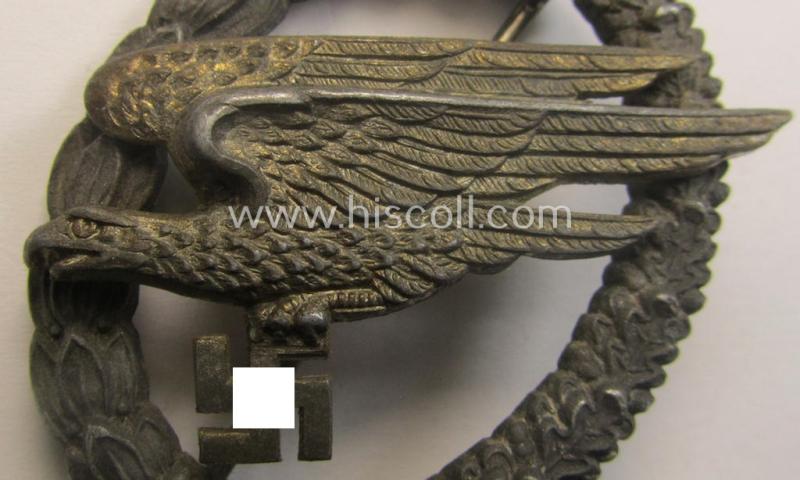 Zinc- (ie. 'Feinzink'-) based version of a WH (Luftwaffe) 'Fallschirmschützen-Abzeichen' (being a maker-marked, 'Type A'-pattern example as was produced by the 'G.H. Osang'-company)