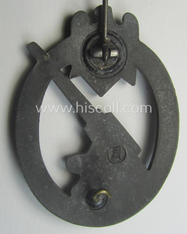 'Heeres-Flakkampf-Abzeichen' being a clearly maker- (ie. 'HA'-marked- and/or zinc- (ie. 'Feinzink'-) based specimen as was produced by the maker (ie. 'Hersteller') named: 'Hermann Aurich'