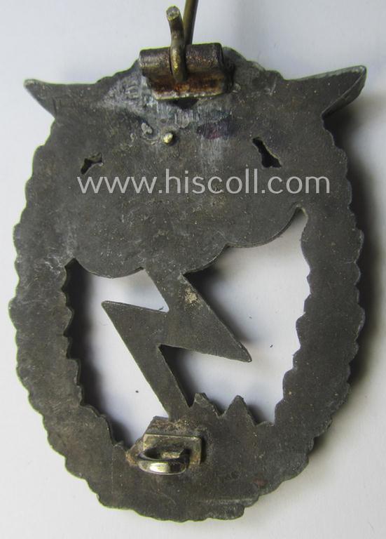 Relic- (ie. denazified), mid- (ie. later-) war-period, zinc- (ie. 'Feinzink'-) based version of a WH (Luftwaffe) 'Erdkampfabzeichen' as was produced by the: 'J.E. Hammer u. Söhne'-company