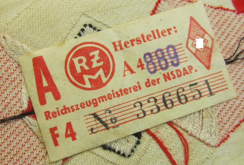 'Standard-issue'-pattern 'Hitlerjugend'- ie. 'Bund Deutsche Mädel (HJ/BDM) so-called: 'Ärmelraute' as executed in so-called 'BeVo'-weave pattern (being a never used- ie. 'virtually mint' example still retaining its period 'RzM'-etiket)