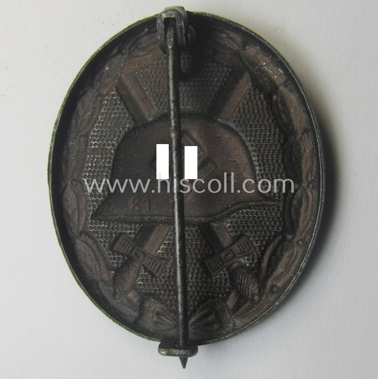 Neatly maker- (ie. '81'-) marked example of a black-class wound-badge (or: 'Verwundeten-Abzeichen in Schwarz') being an example that was produced by the maker (ie. 'Hersteller') named: 'Overhoff & Cie.'