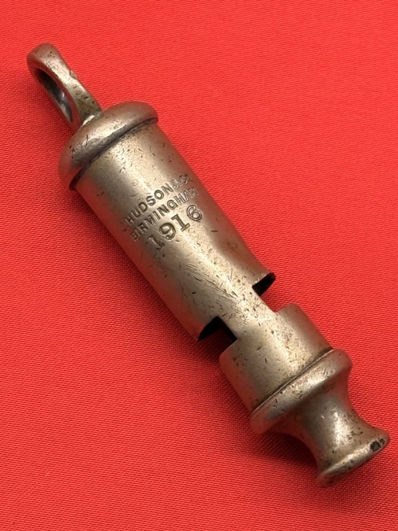 TWO AUTHENTIC ORIGINAL BRITISH OFFICERS WWI 1916 TRENCH WHISTLES AND LANYARD.