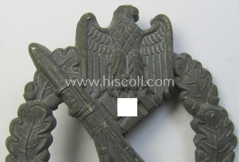 Attractive, 'hollow-back'-pattern 'Infanterie Sturmabzeichen in Silber' (or: silver infantry-assault badge ie. IAB) being a non-maker-marked example as executed in zinc-based metal (ie. 'Feinzink') as was produced by the: 'Wilh. Deumer'-compa...