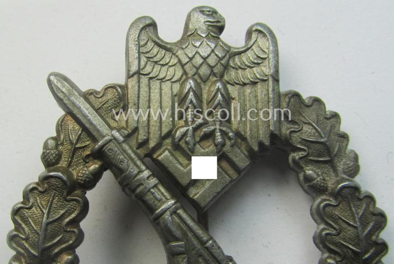 'Infanterie Sturmabzeichen in Bronze' (or bronze-class IAB) being a non-maker-marked, typical zinc- (ie. 'Feinzink'-) version ie. 'variant' as was (I deem) procuded by the: 'Funcke u. Brüninghaus'-company