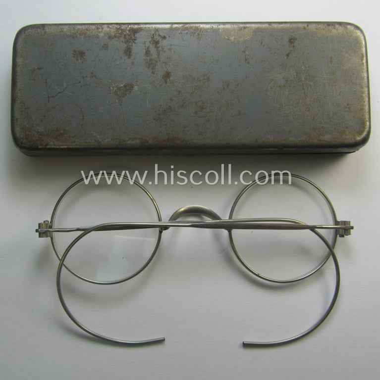 Complete pair of 'standard-issued'-pattern, WH-service-glasses (ie. 'Dienstbrille') as issued to the: 'Gefr. Peter Thönes' (or alike) serving within the 'Truppenteil': 'L47425' and that comes stored in its period-container