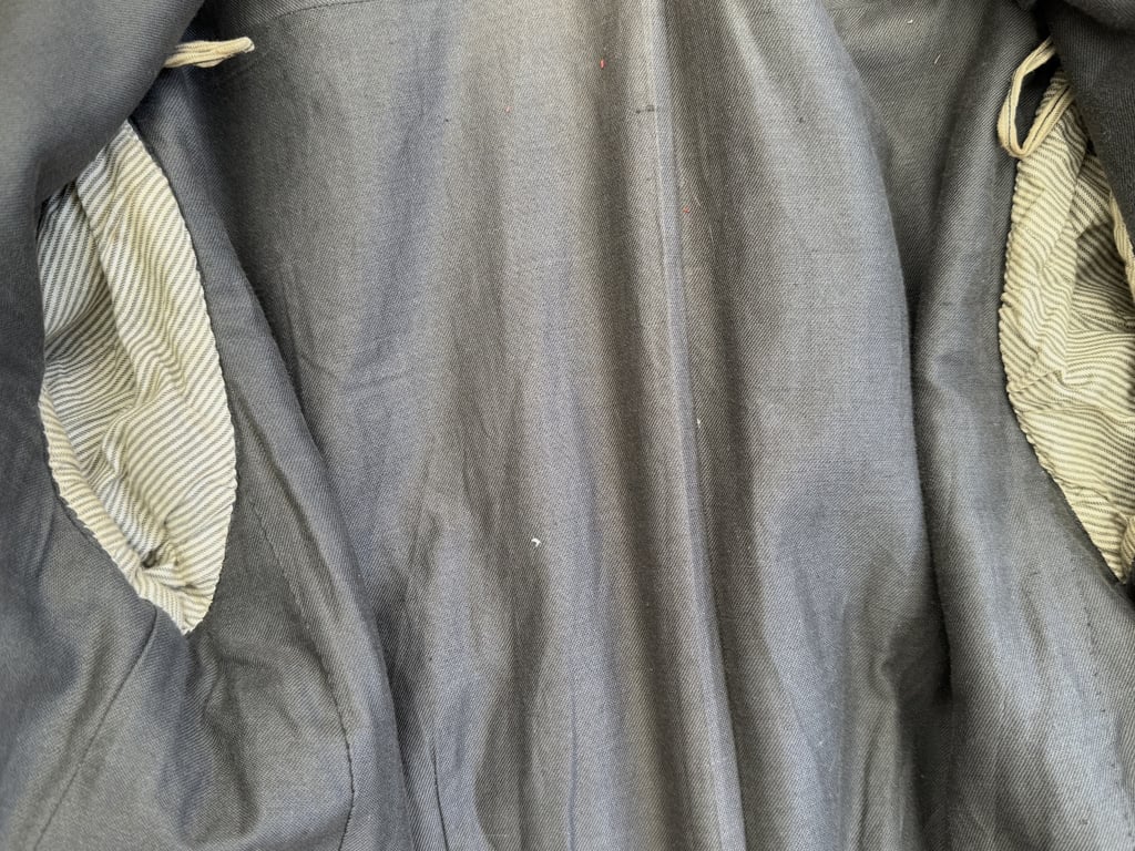 DRK (Deutsches Rotes Kreuz)  Vorhelfer service tunic with original insignia and armband.