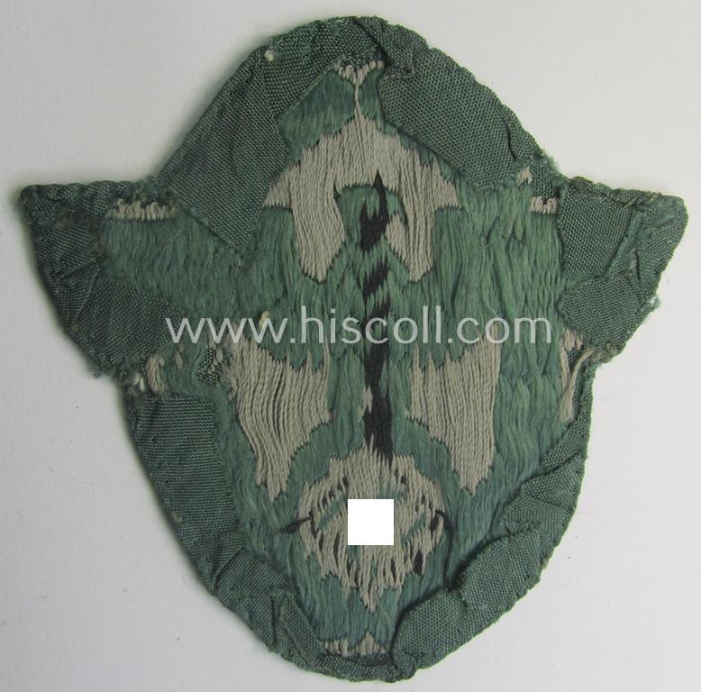 Clearly used- and/or tunic-removed, police- (ie. 'Polizei'-) related armbadge (ie. arm-eagle) being a typical 'BeVo'-woven example