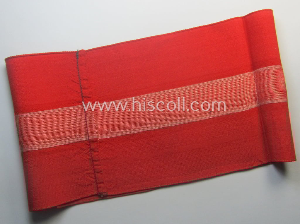 'Standard-issued'-pattern (ie. entirely woven) pattern, bright-red-coloured HJ- (ie. 'Hitlerjugend'-) related armband (ie. 'Armbinde') being a moderately worn- ie. used example that misses its 'RzM'-etiket
