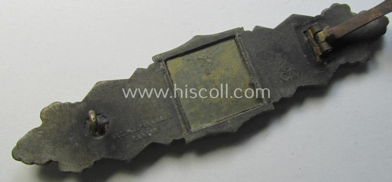 'Nahkampfspange in Bronze' (or: bronze-class close-combat clasp ie. CCC) being a maker- (ie. 'FLL'-) marked- and/or non-converse-shaped so-called: '3rd pattern'-specimen as was produced by the maker- (ie. 'Hersteller') 'Friedrich Linden'