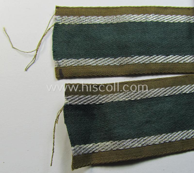 Attractive, 'BeVo'-like cuff-title (ie. 'Ärmelstreifen') entitled: 'Afrikakorps' being a with certainty issued and truly worn example that comes in an overall nice- (ie. minimally shortened- and/or once tunic-attached-), condition