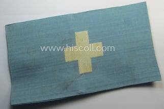 Linnen-based- and/or light-blue-coloured armband (ie. 'Armbinde') depicting an...