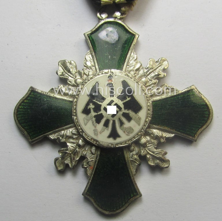 Superb - and most certainly unusually seen! - neatly enamelled and darker-green-toned, TR-period shooting-medal that shows on its back the text: 'Für förderende Mitarbeit - priv. Schützen-Gesellschaft - Netzschkau - 3. III. 1941'