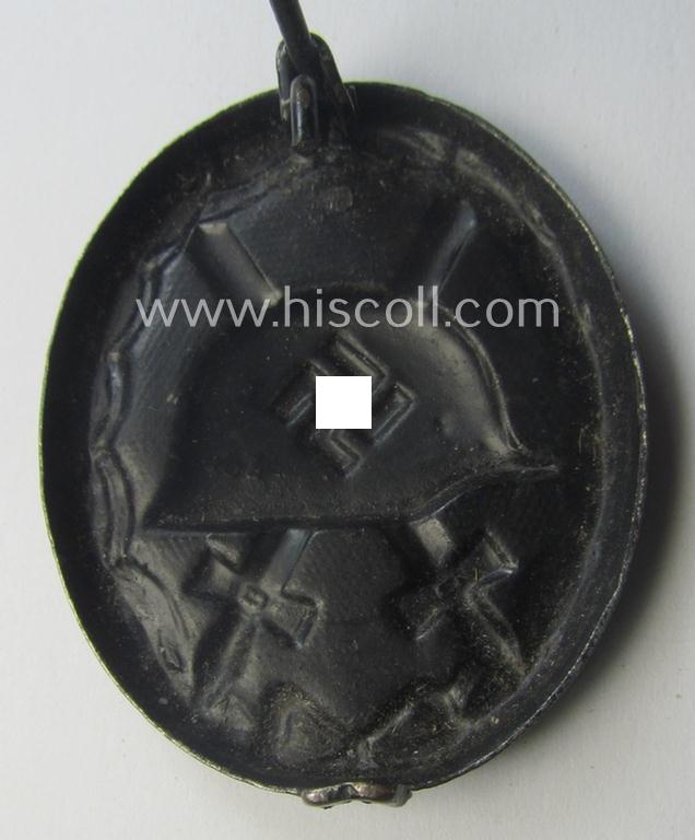 Maker- (ie. '63'-) marked example of a black-class wound-badge (or: 'Verwundeten-Abzeichen in Schwarz') being an example that was produced by the maker (ie. 'Hersteller') named: 'F.J. Klast & Söhne'