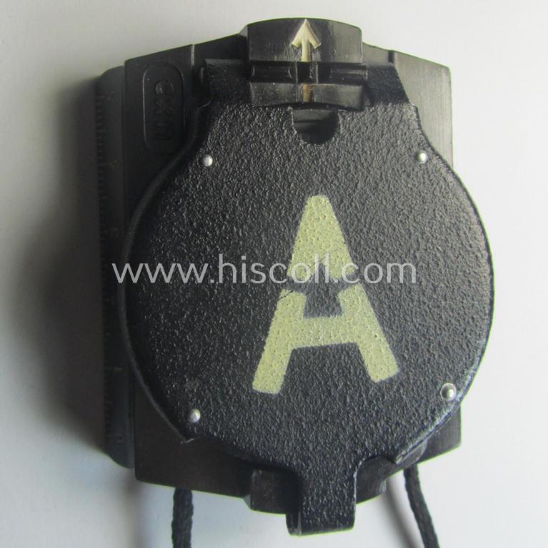 'Standard-issue'-pattern WH compass (or: 'Marschkompass') as executed in black-coloured 'Bakelite' being - I deem - a later-war-period- and/or maker- (ie. 'CXN'-) marked example that comes mounted on its period cord
