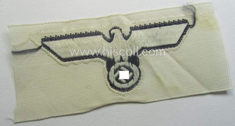 WH (KM) EM- (ie. NCO-) type side-cap-eagle (ie. 'Schiffchenadler für Mannschaften u. Uffz. der KM') as executed in the 'BeVo'-weave-pattern on a white-coloured background as was specifically intended for usage on the various white-coloured side-c...